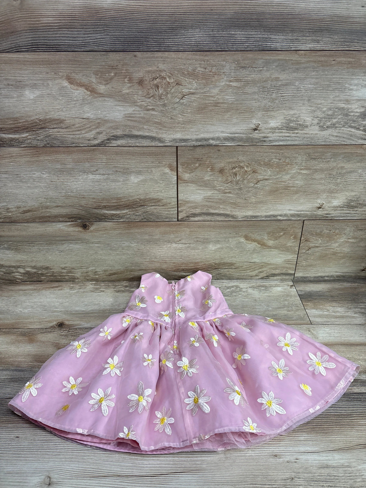 Pink sleeveless Disney Store Minnie Mouse dress with white daisy embroidery for size 2T.