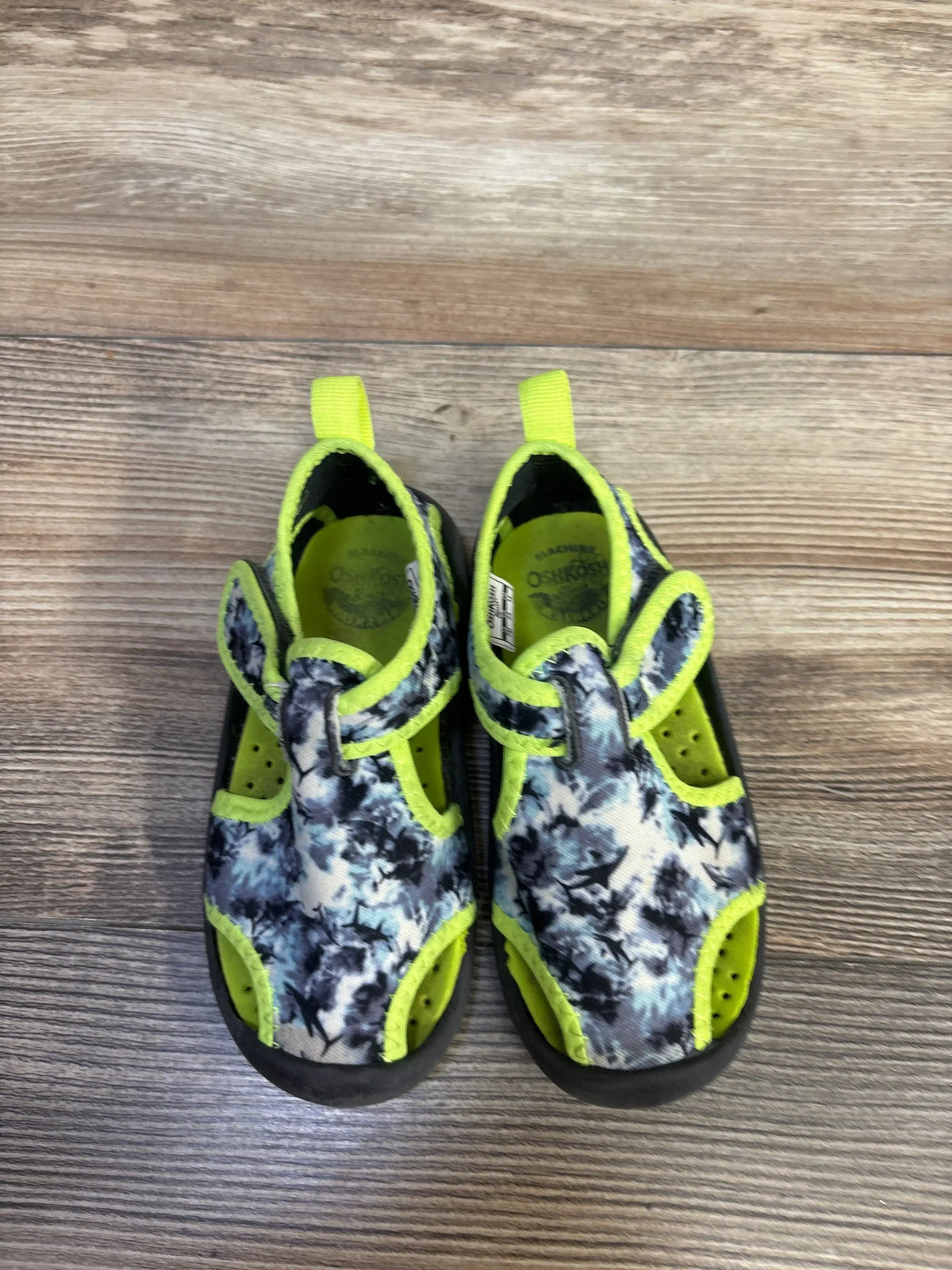 Top view of OshKosh aquatic water shoes in grey and green showcasing camouflage pattern and hook and loop closures