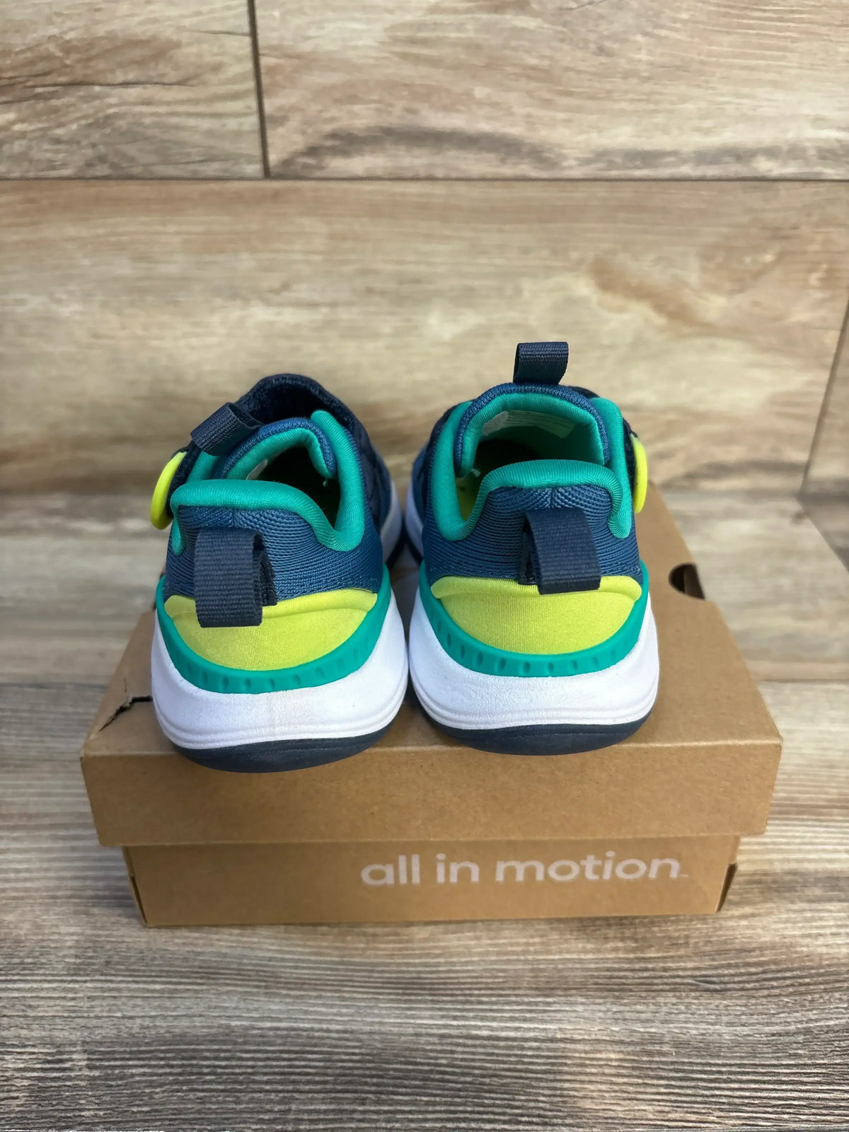 Back view of All In Motion Quinn toddler sneakers size 8C, blue teal and yellow with hook-and-loop straps on a shoebox