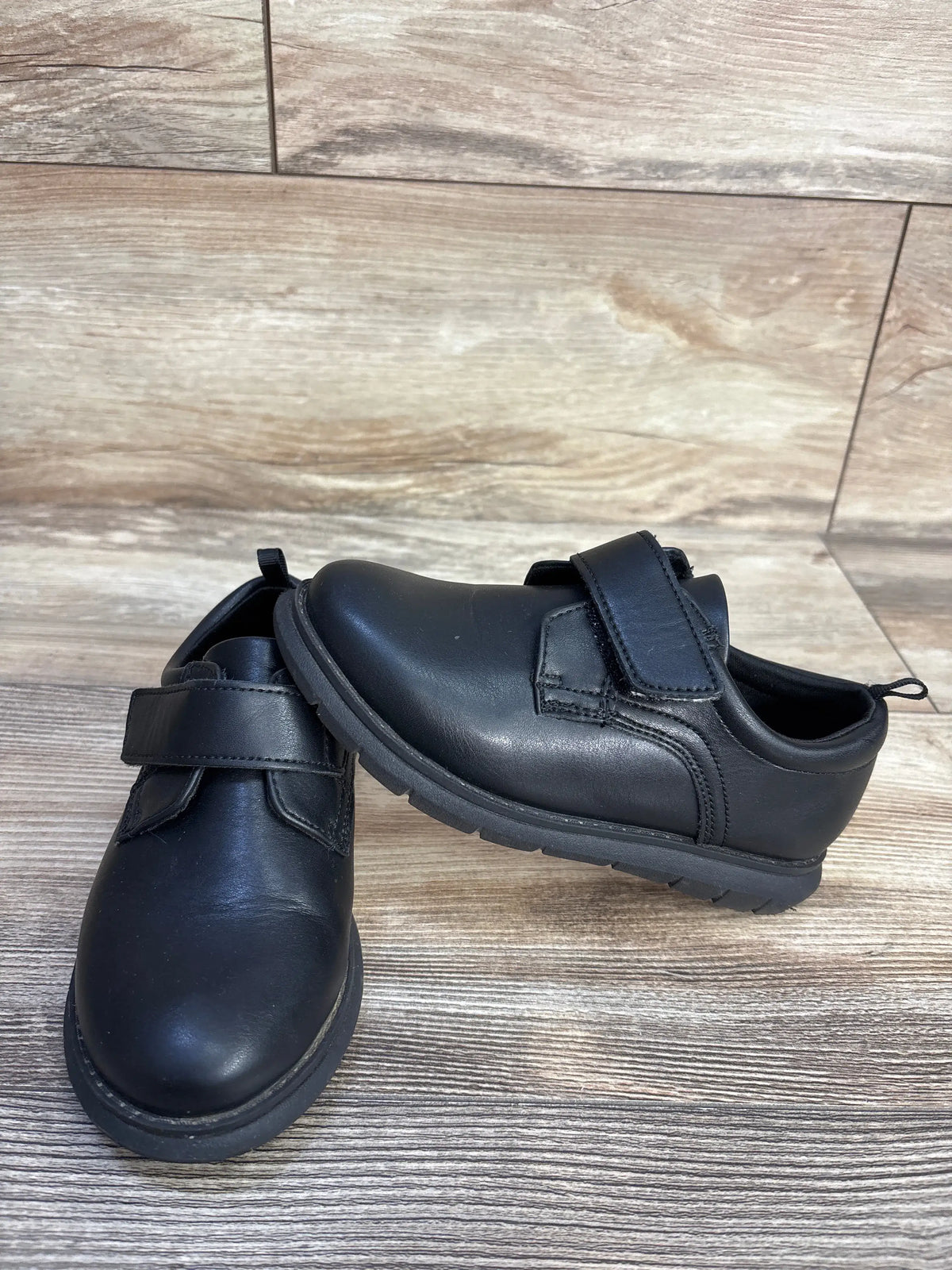 Pair of black Wonder Nation Oxford dress shoes for kids with strap closures.