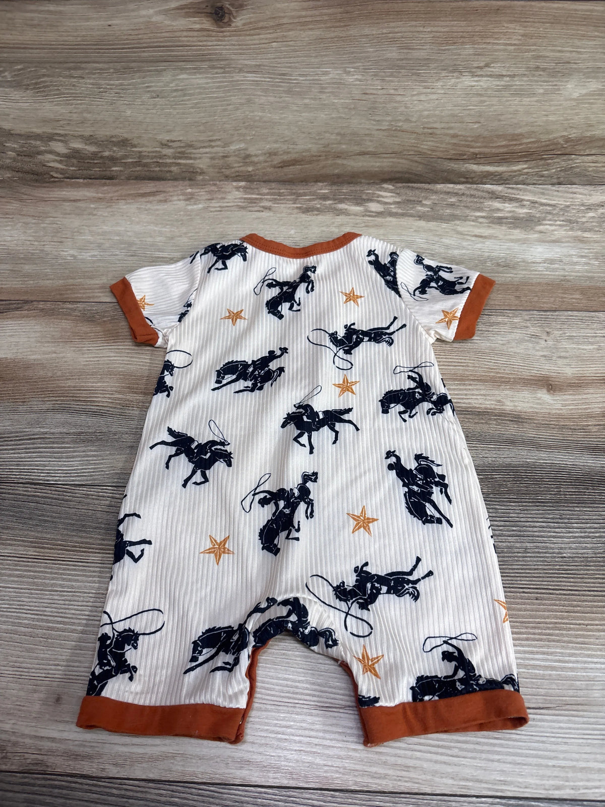 SAYOO Western Romper in cream with navy cowboy and horse print and rust orange trim