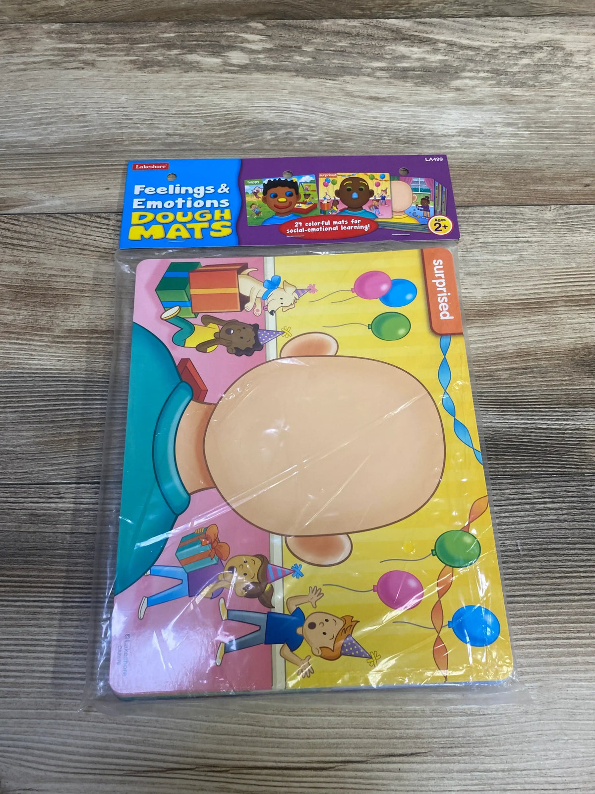 Front view of NEW Lakeshore Feelings and Emotions Dough Mats showing a surprised emotion mat in sealed packaging