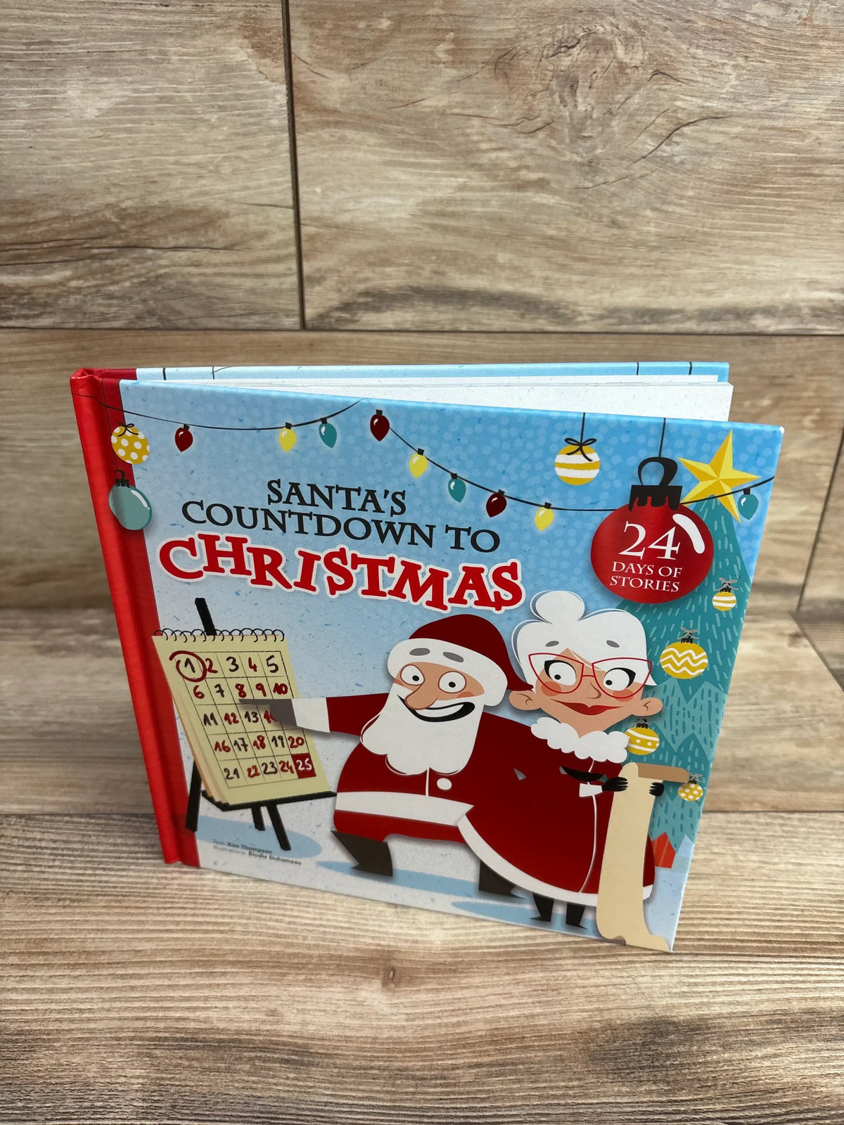Santa's Countdown to Christmas book with 24 days of stories, festive illustrations, holiday lights, and Santa & Mrs. Claus on cover