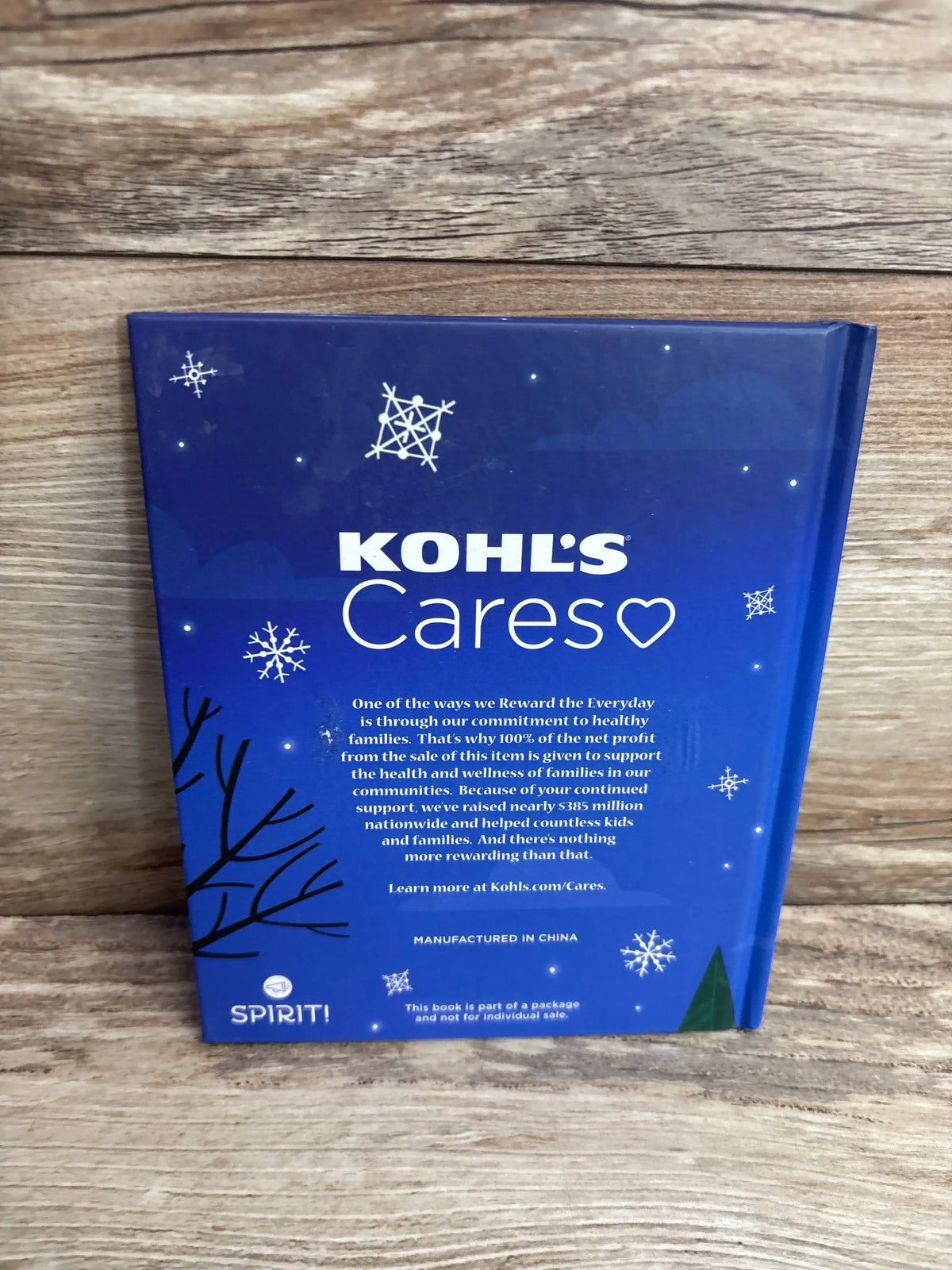 Kohl's Cares children's book with snowflakes and tree design, supporting kids and families
