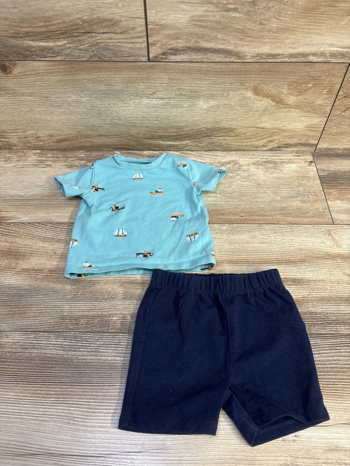 Pekkle 2pc baby set featuring a light blue boat print shirt and navy blue shorts