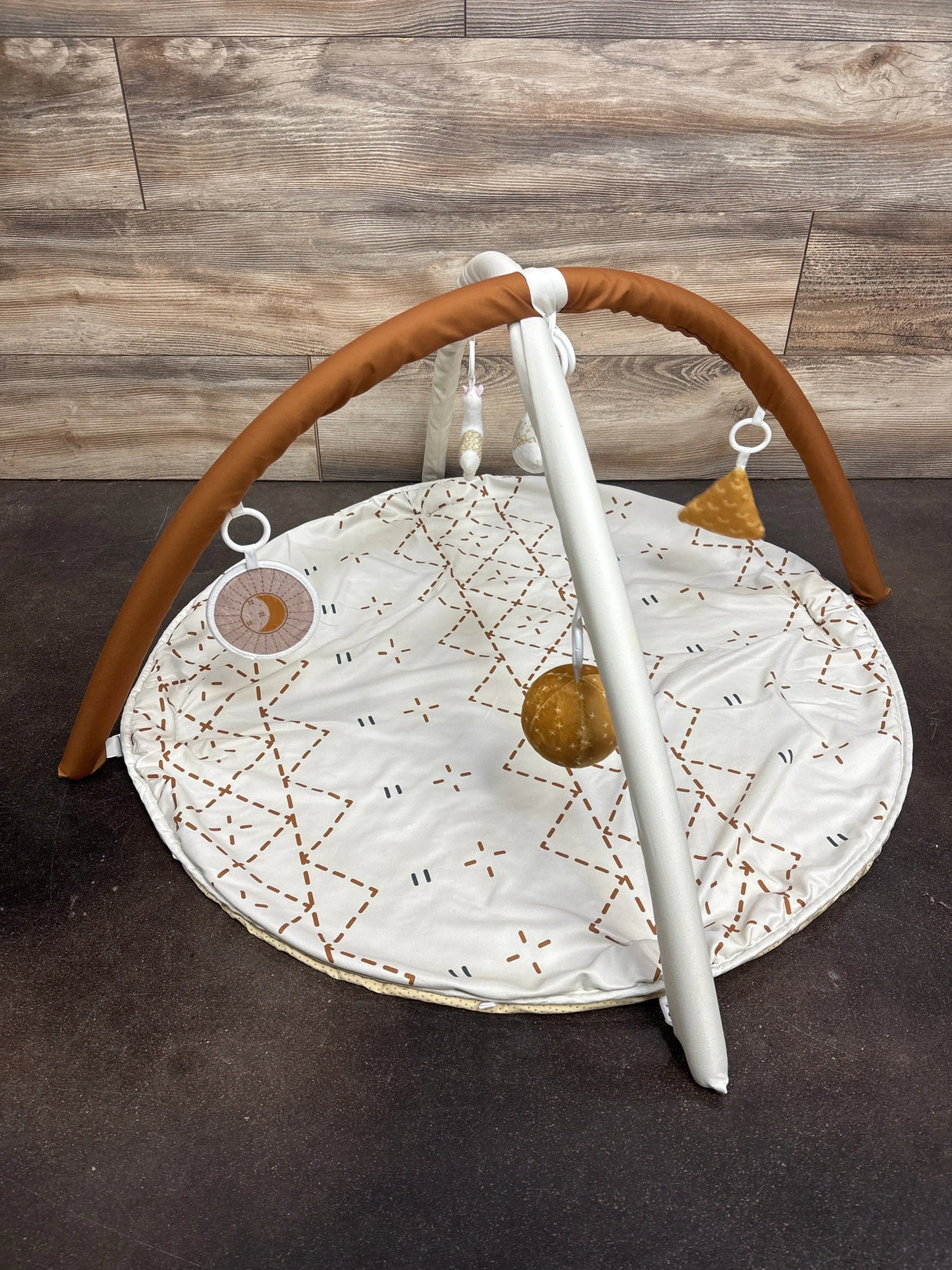 Baby activity gym with soft toys, moon design, and geometric patterns on play mat for newborns and infants