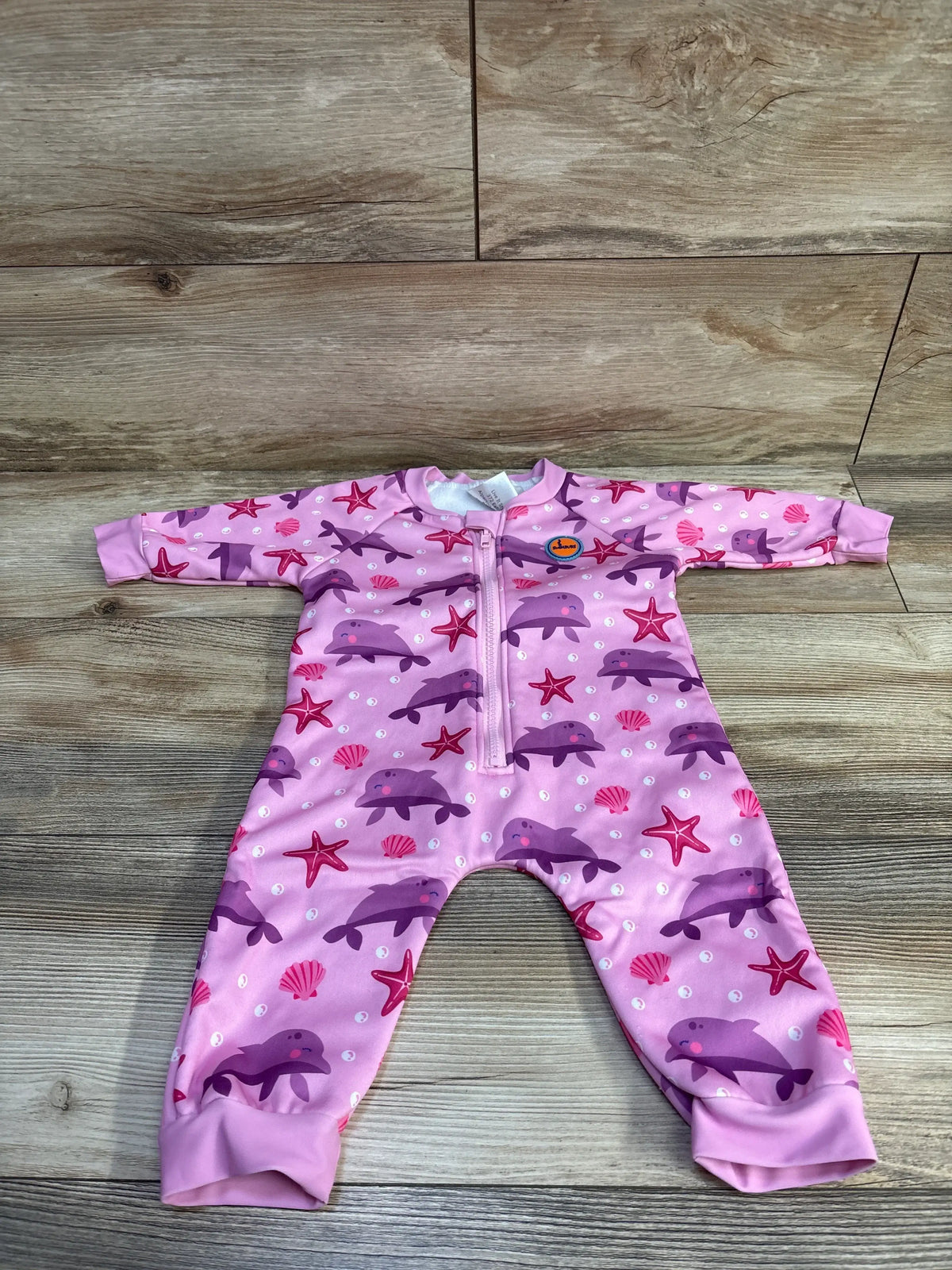 Front view of pink Soft Fleece Lined Warm Wetsuit with dolphin print, long sleeves, full legs, and front zipper