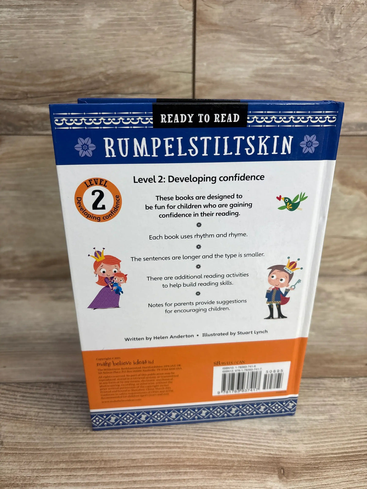 Back cover of Level 2 Ready to Read Rumpelstiltskin children's book on wood background