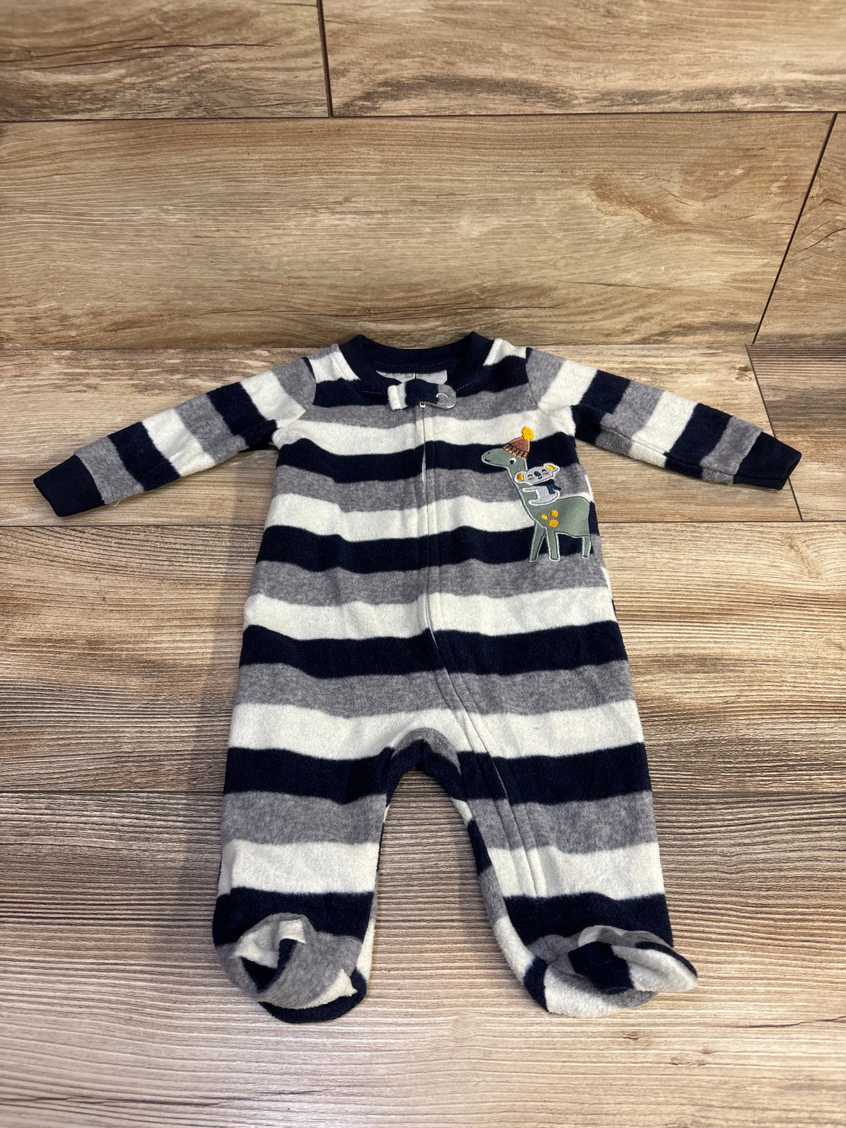 Flat lay of Koala Baby navy gray white striped footed sleeper showing zip front and animal applique