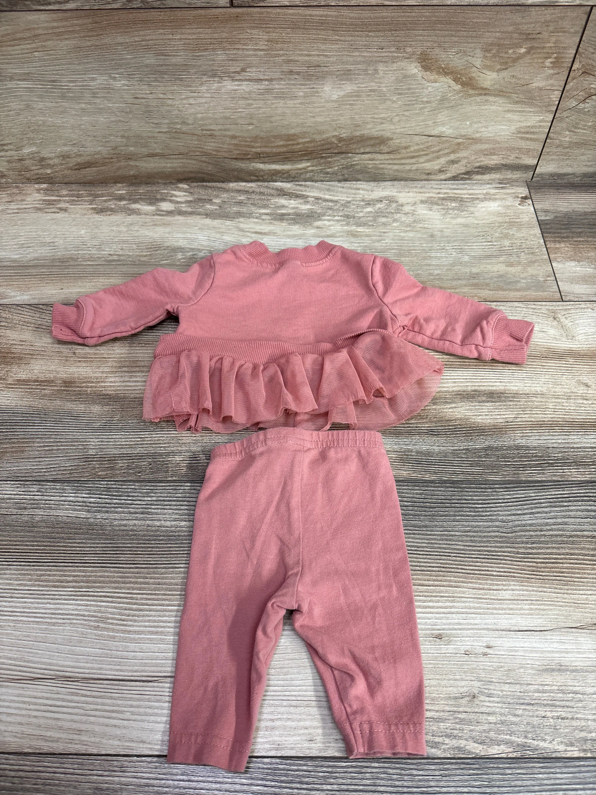 Carter's 2-piece pink newborn sweatshirt with ruffle hem and matching pants set