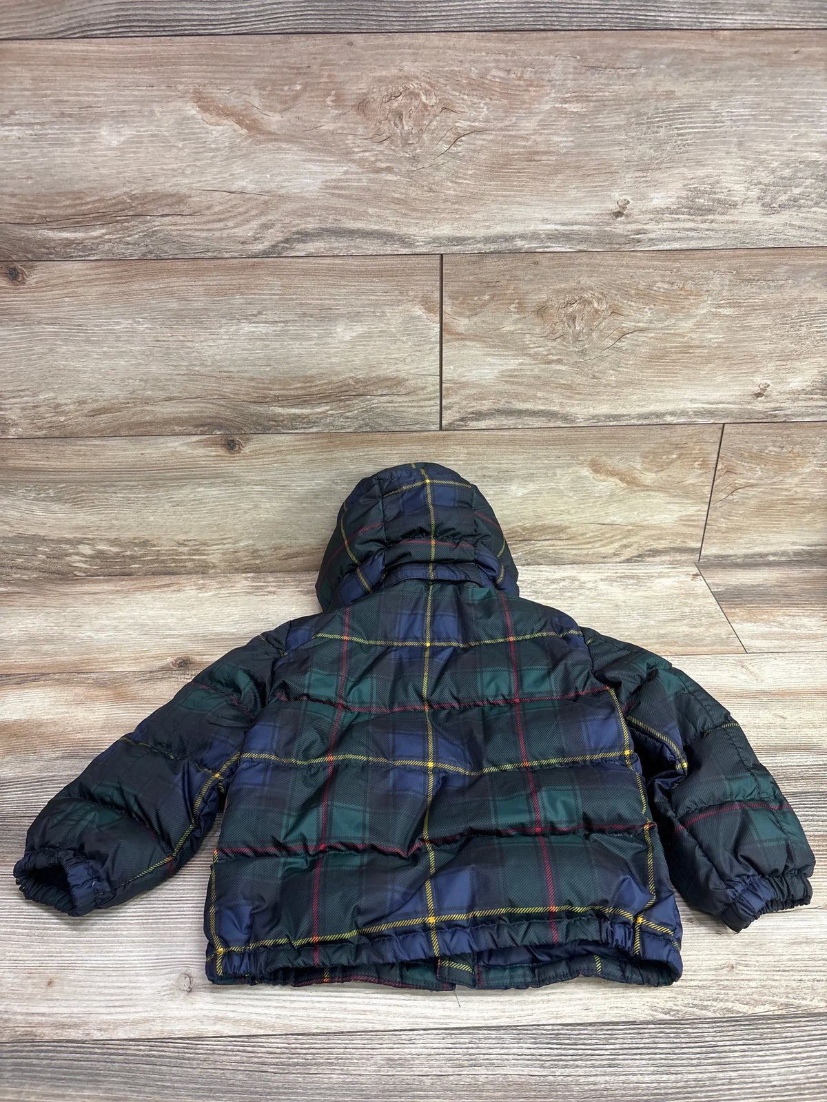 Back view of a Ralph Lauren green and blue plaid hooded puffer jacket for toddlers.