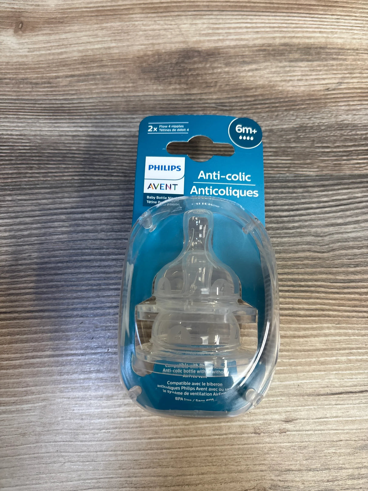 Philips Avent anti-colic baby bottle nipples in packaging on wood background