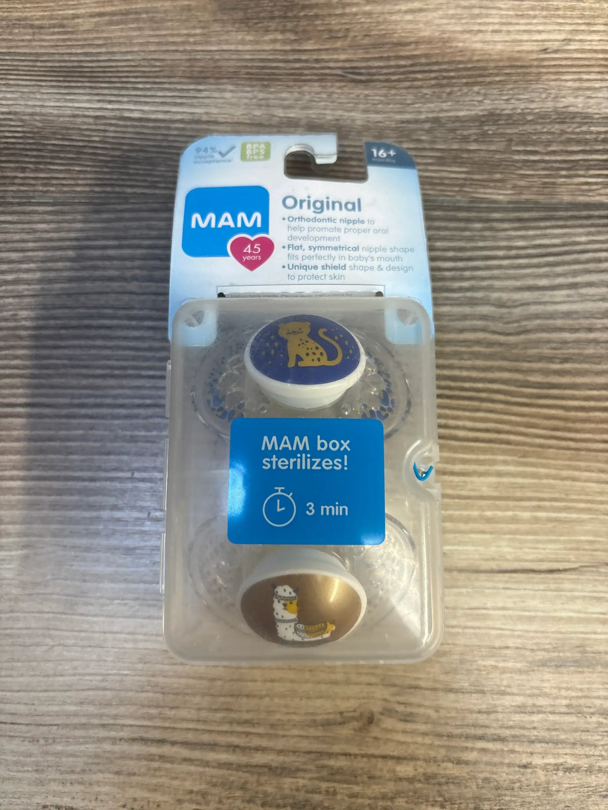 MAM Original orthodontic pacifiers for 16+ months, animal designs, in retail packaging on wood surface
