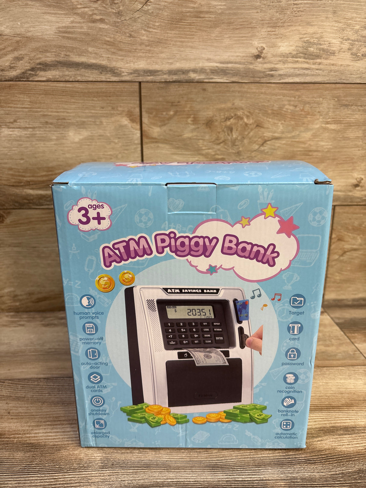 Front of NEW Fishboy Talking ATM Piggy Bank box showing ATM design, keypad, LCD screen, card slot, bill slot, coins and play money