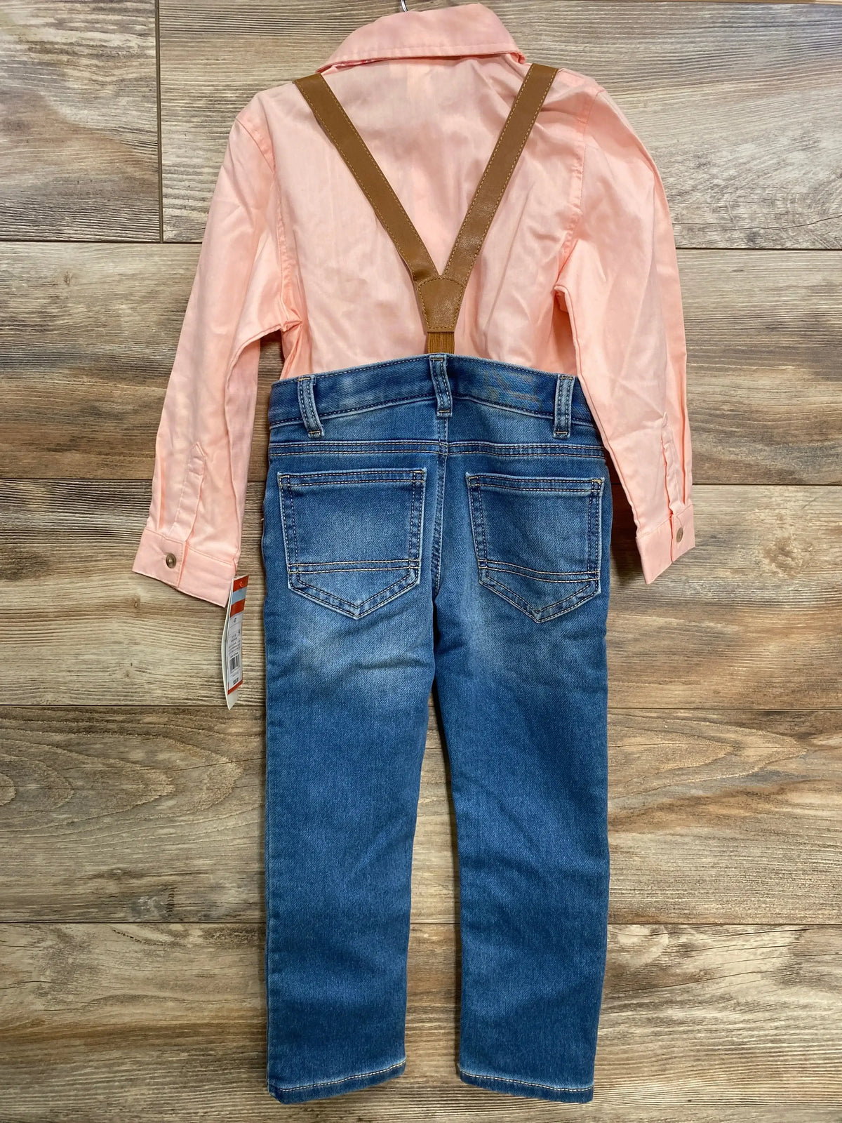 Back flat-lay of Cat & Jack 4pc suspender set: pink button-up shirt and blue jeans with brown Y-back suspenders on wood floor