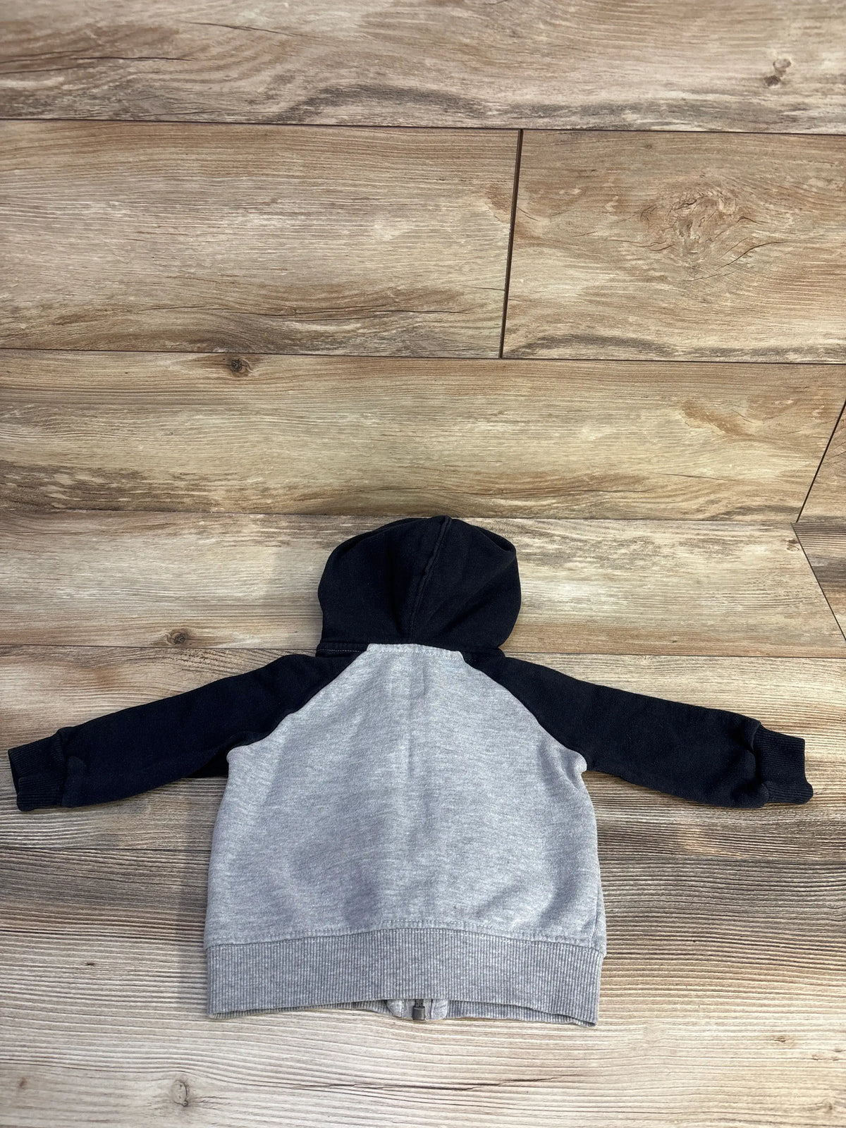 Grey and black full zip hooded jacket for infants by Me n Mommy To Be on a wood background
