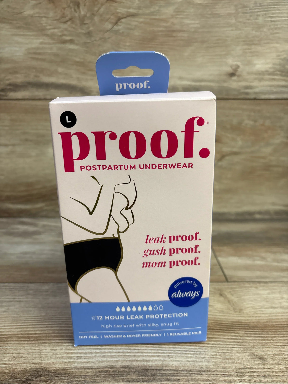Front view of NEW Proof Reusable Postpartum Underwear high rise brief size Large showcasing sealed retail box with 12 hour leak protection text on wood plank floor