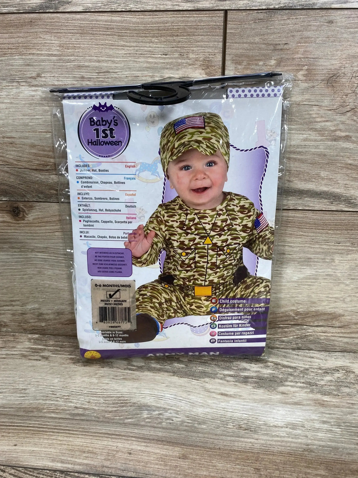 Front view of Rubie’s Baby’s 1st Halloween Army Man costume showing camouflage jumpsuit, hat, and booties in 0 to 6 months packaging