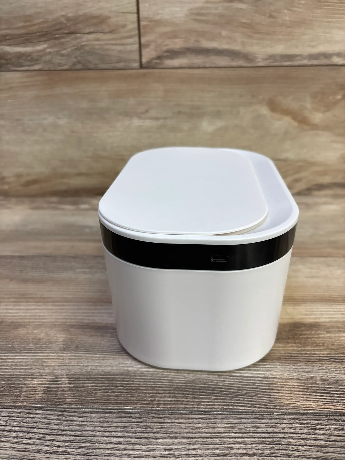 Front view of ZJchao baby wipes warmer showcasing white rounded-rect container with black night-light band and visible USB port on wooden surface