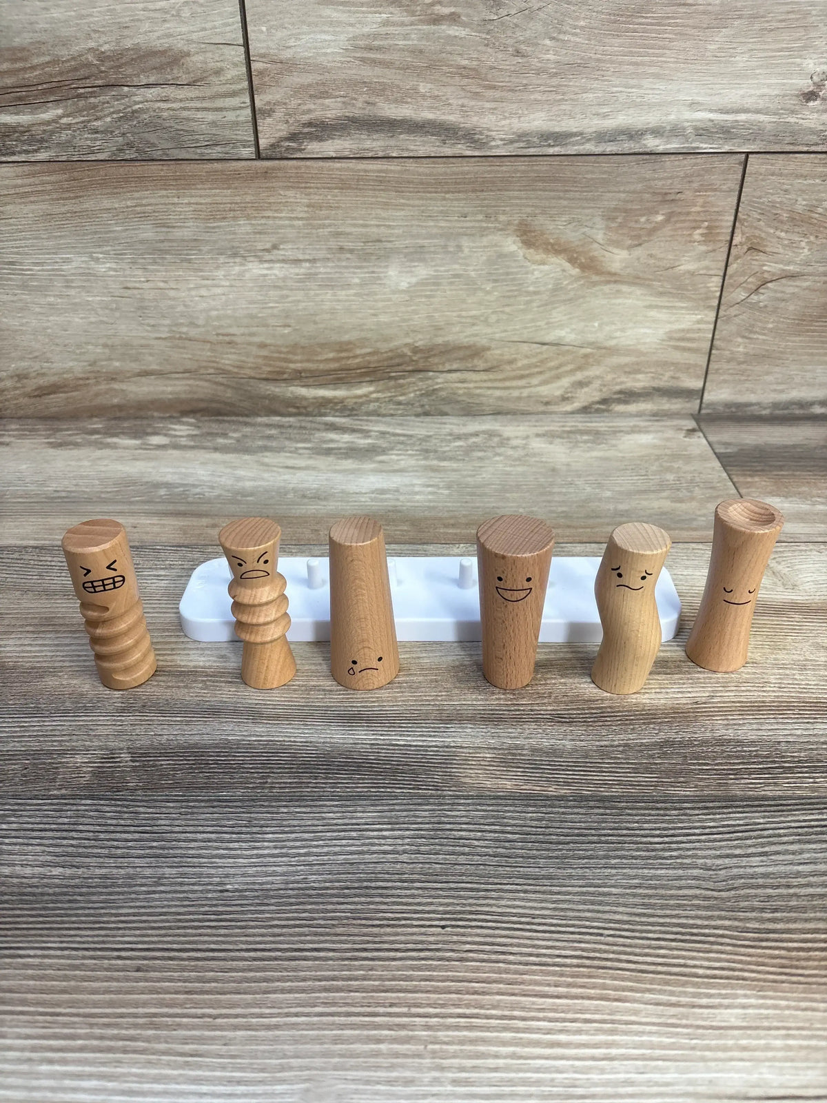 Wooden emotion figures with smiling, sad, angry faces for kids' emotional learning toys
