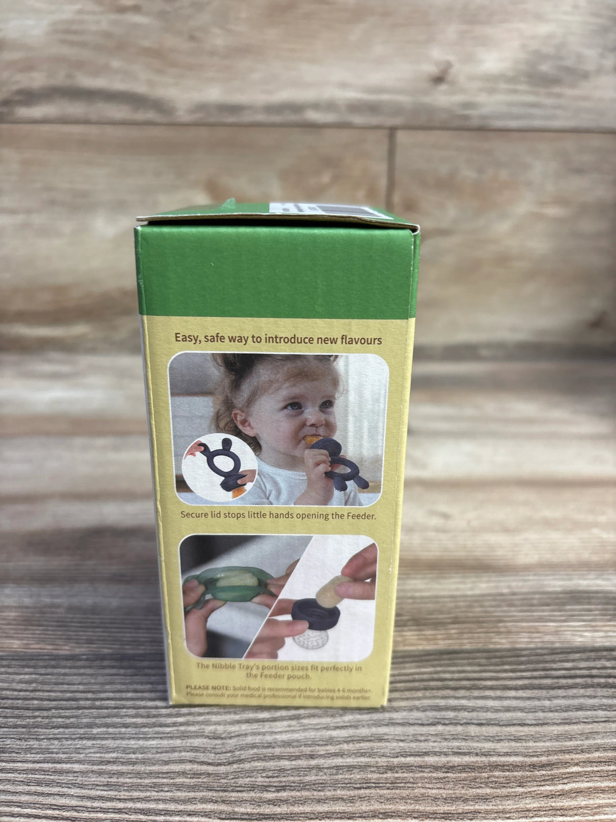 Front view of Haakaa Freeze-N-Feed Mini Combo box showing product photos and headline ‘Easy, safe way to introduce new flavours’ on wooden surface