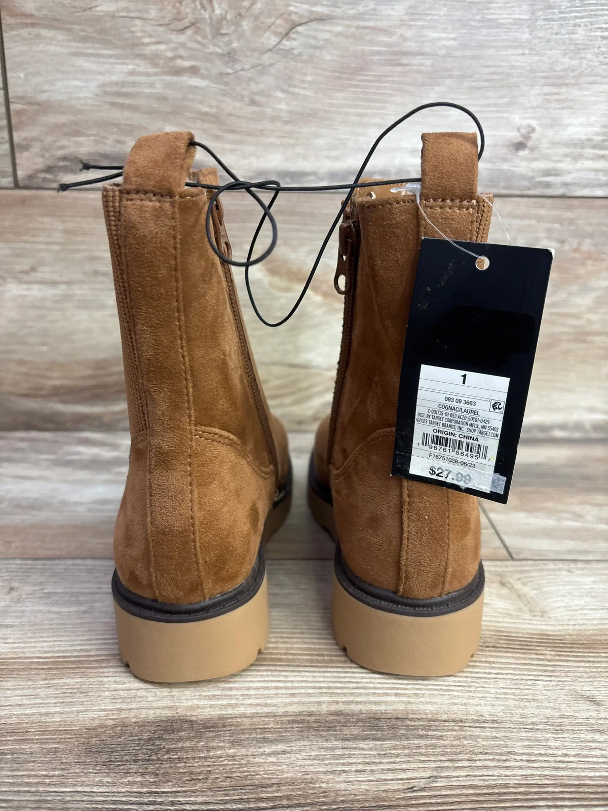Back view of Art Class Laurel zipper boots in cognac showing suede texture, rear pull tab and chunky tan sole on wooden floor