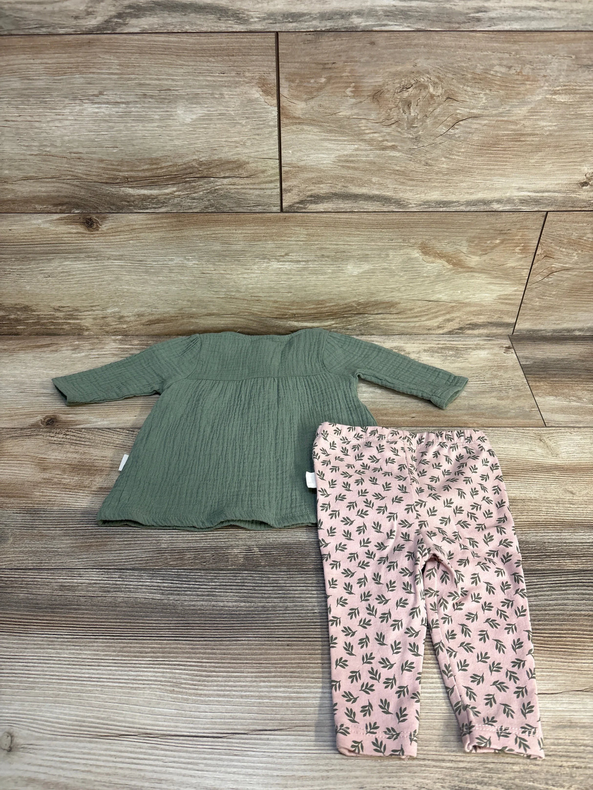 Green long-sleeve top and pink leaf-print leggings for baby or toddler