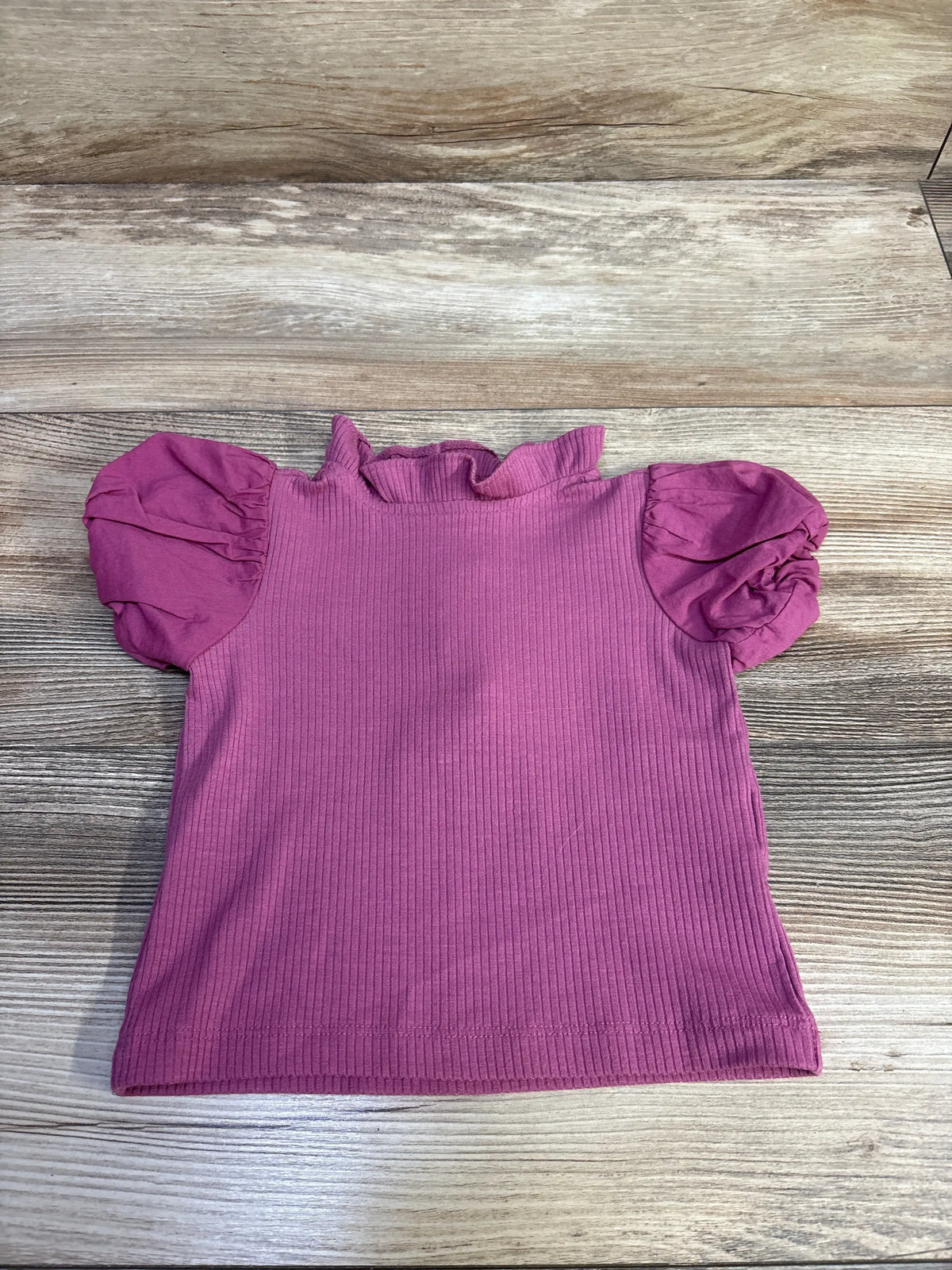 Front view of Janie & Jack mauve ribbed top in size 18 to 24 months showcasing collared puff sleeves on a wood background
