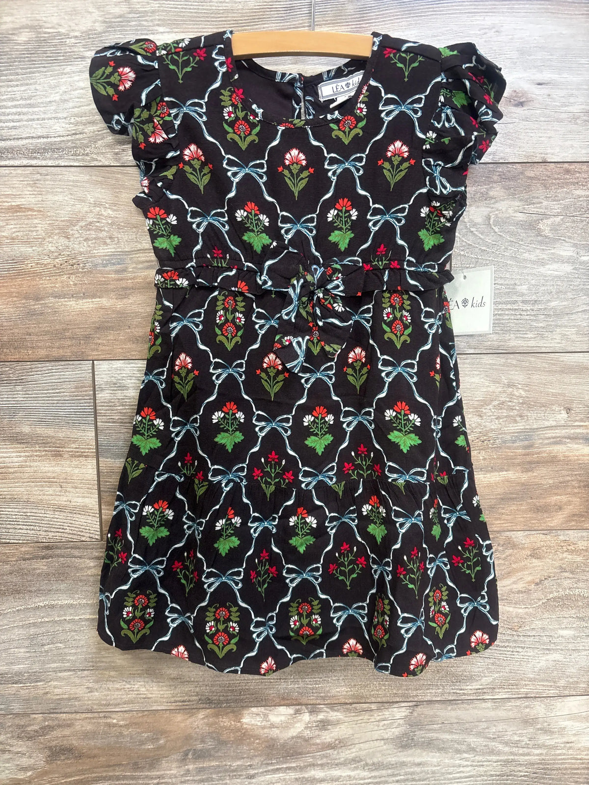 Front view of NEW Lea Kids floral flutter sleeve dress in brown, size 4T, on a wooden hanger