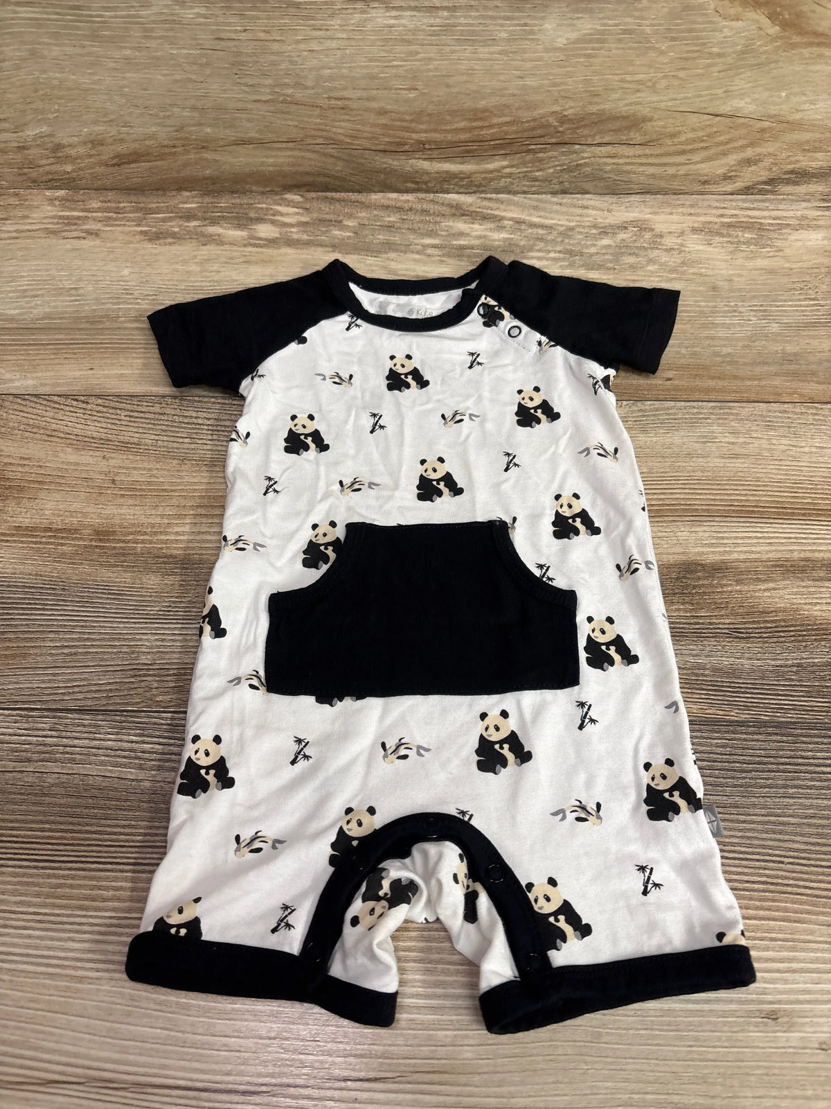 Kyte Baby Bamboo panda print shortie romper in white with black sleeves and pocket