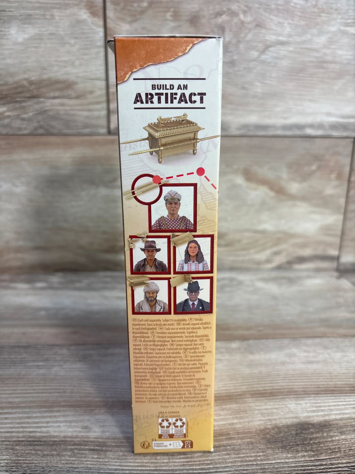 Toy box side featuring 'Build an Artifact', Ark model, and five adventurer character photos