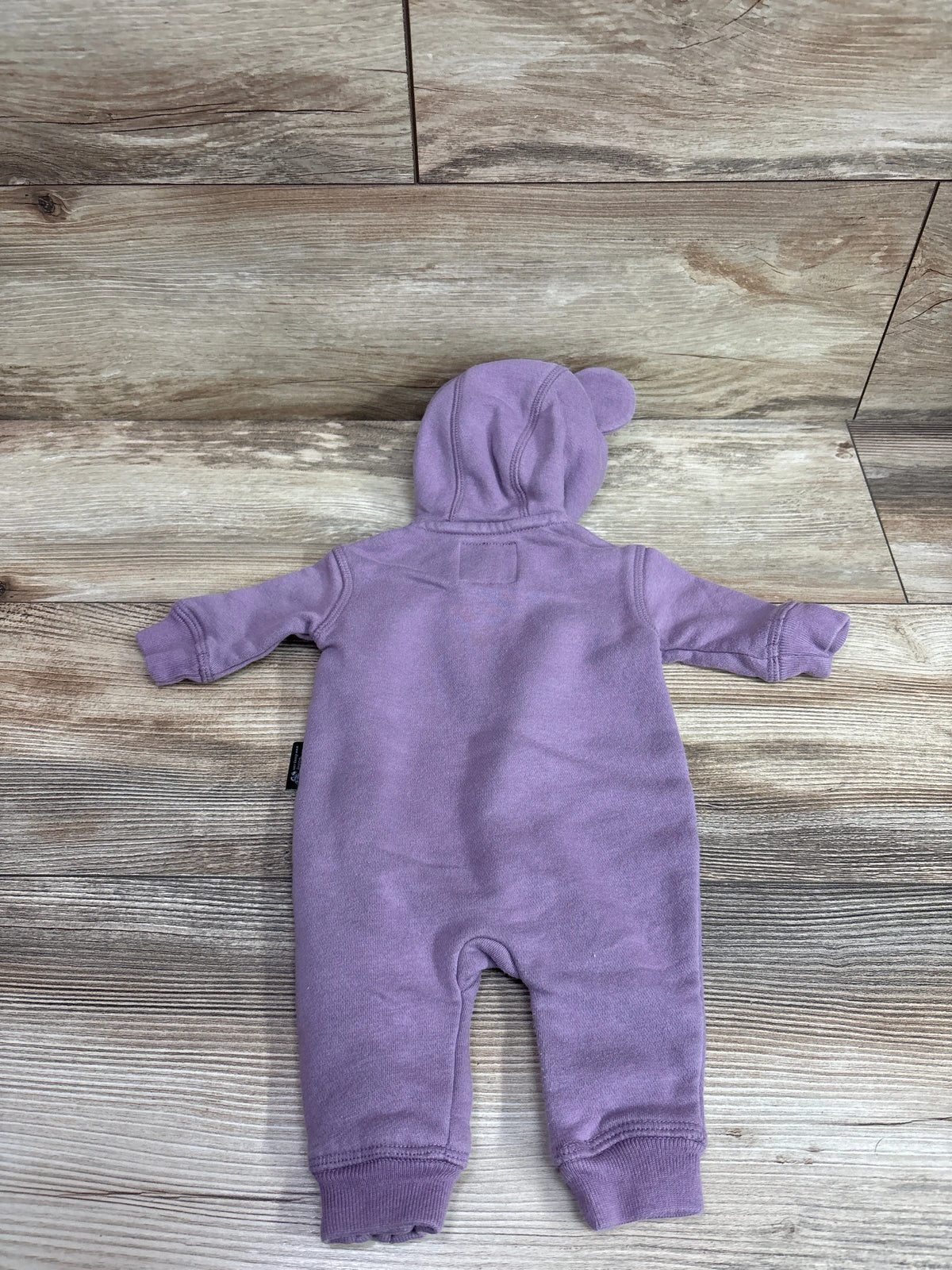 Back view of a purple Baby Gap x Disney Minnie Mouse hooded coverall for newborns.
