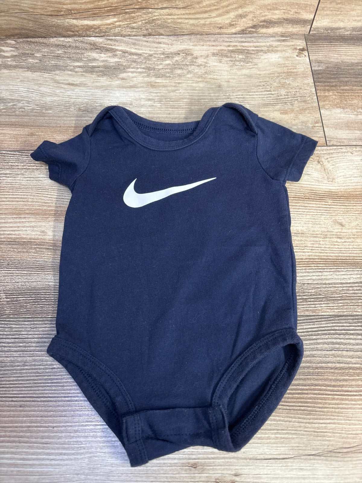 Navy blue Me n Mommy To Be baby bodysuit featuring a white swoosh logo on the chest