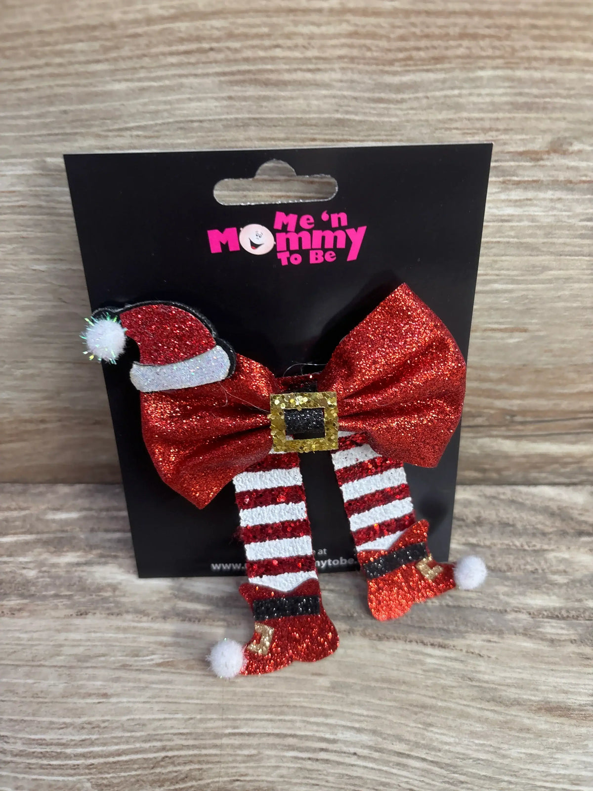 Glittery red Santa bow with hat and striped legs, festive holiday kids accessory