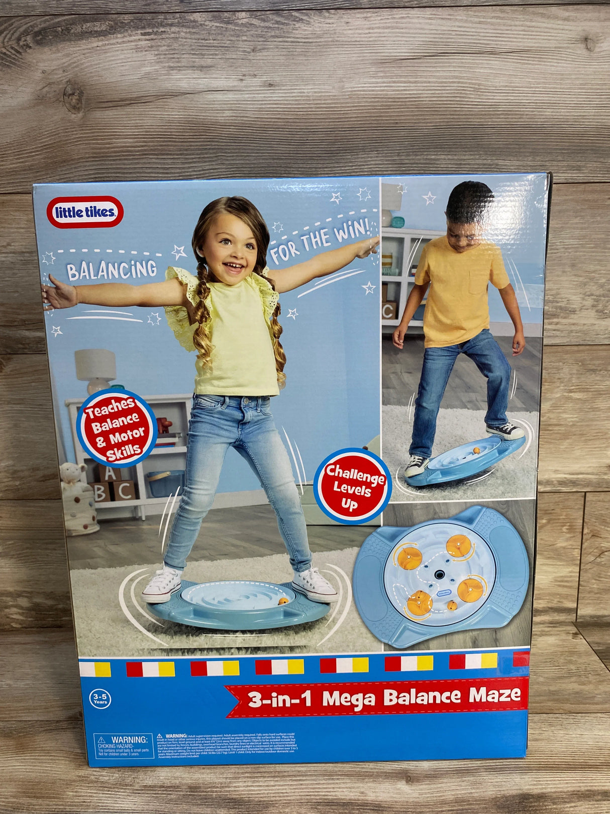 Little Tikes 3-in-1 Mega Balance Maze toy box with kids balancing on blue board