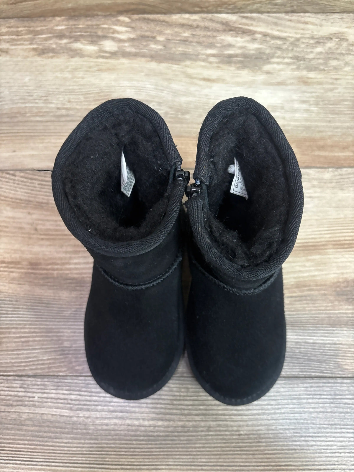 Top view of black BearPaw Eliza Boots for kids showing faux-fur lining and side zipper.