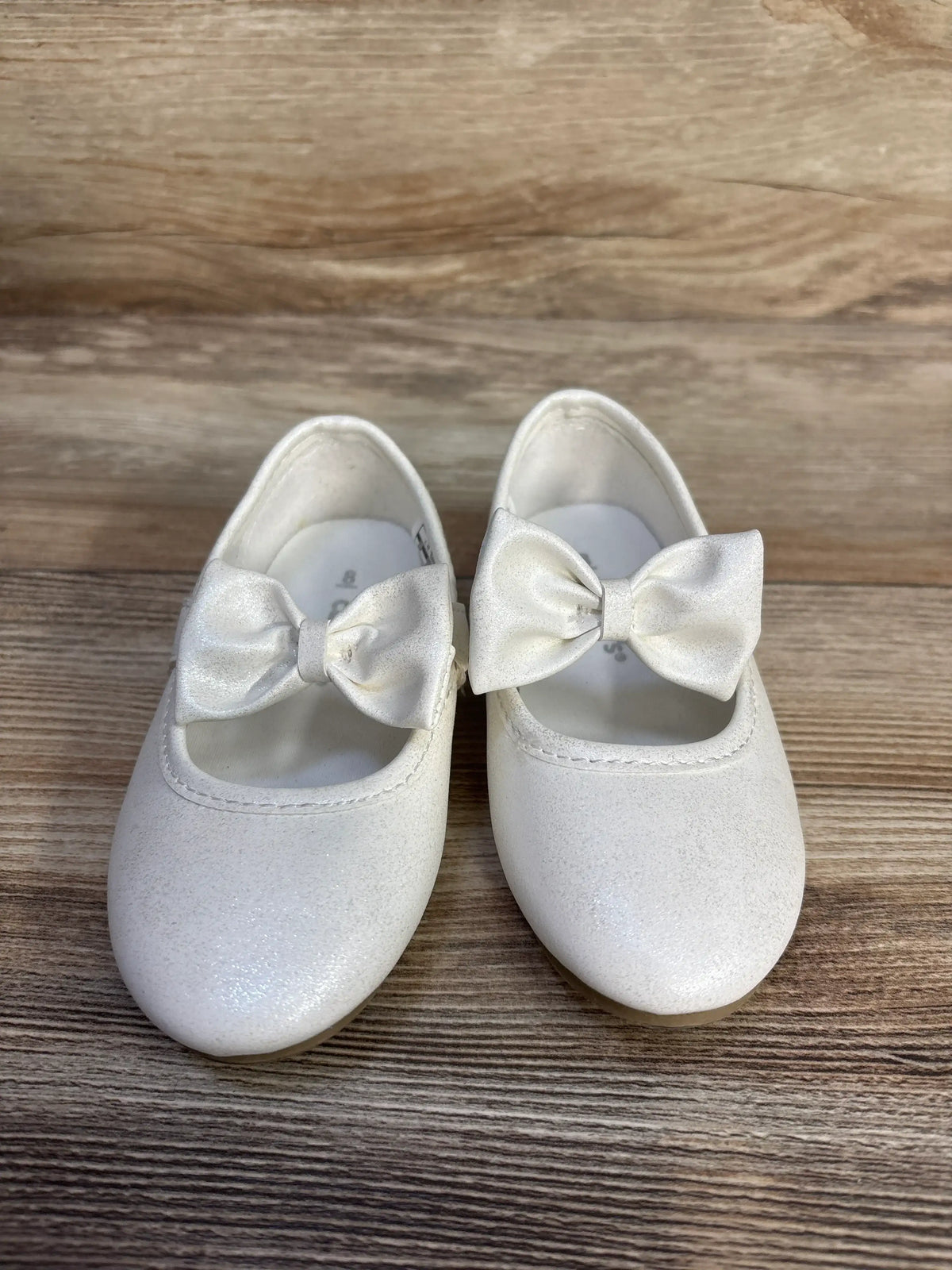 Pair of white shimmering Mary Jane flats with bows for toddlers by Me n Mommy To Be.