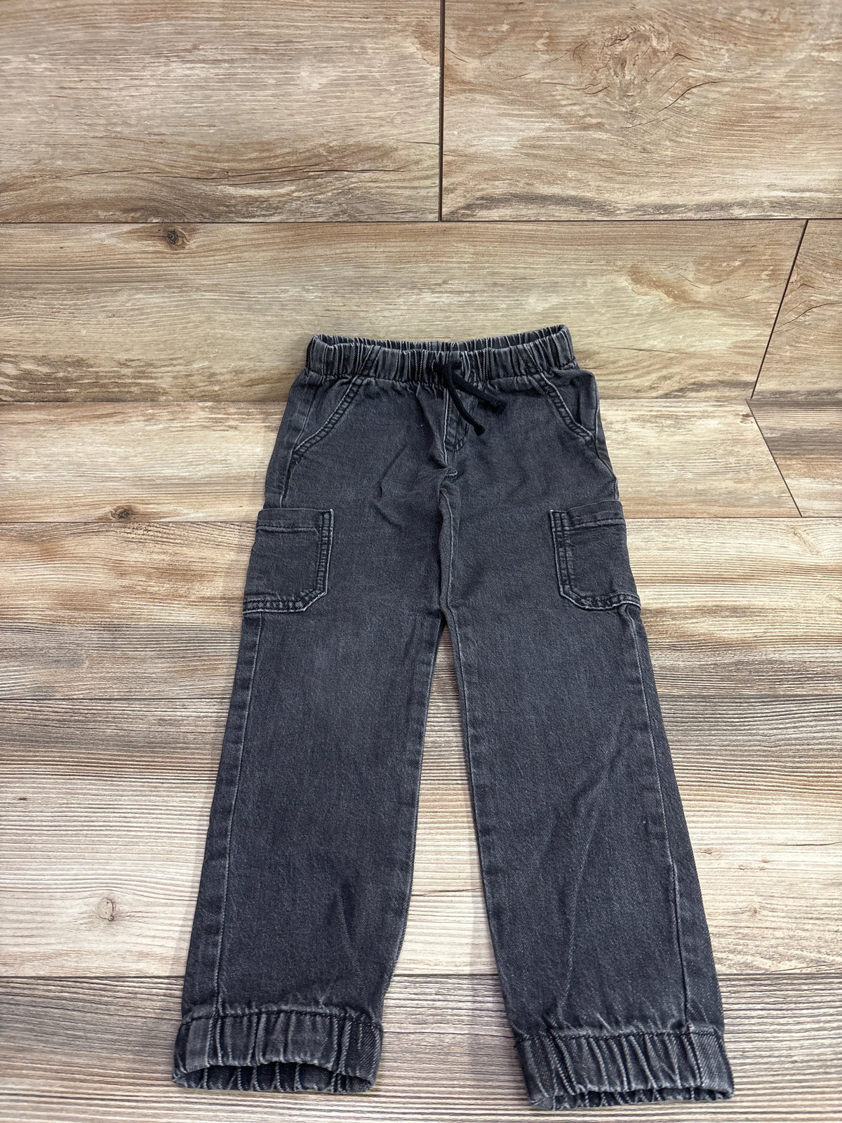 Black Cat & Jack denim drawstring joggers for kids size 5T on a wood background