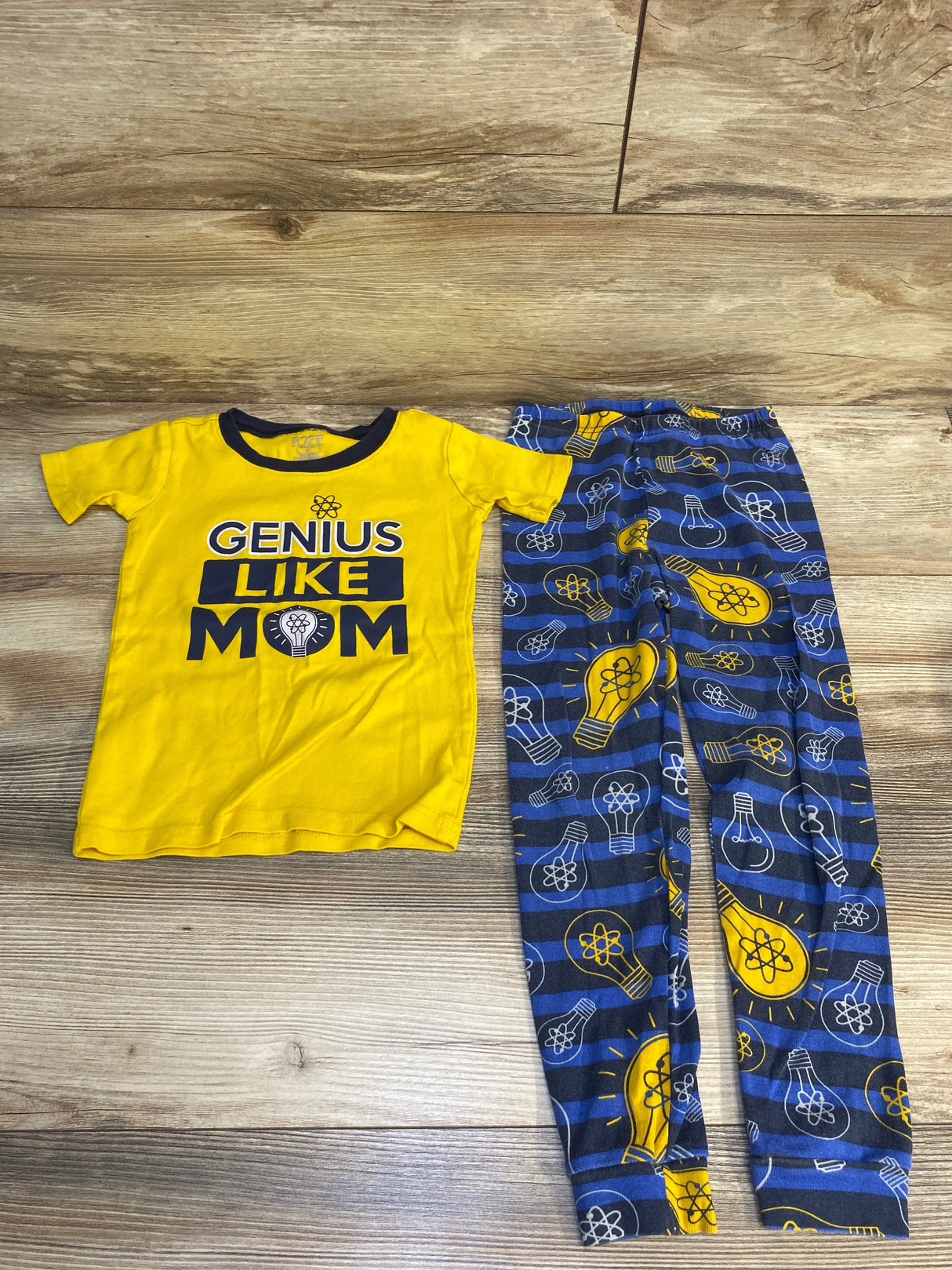 Yellow "Genius Like Mom" kids T-shirt with matching blue science-themed pants set