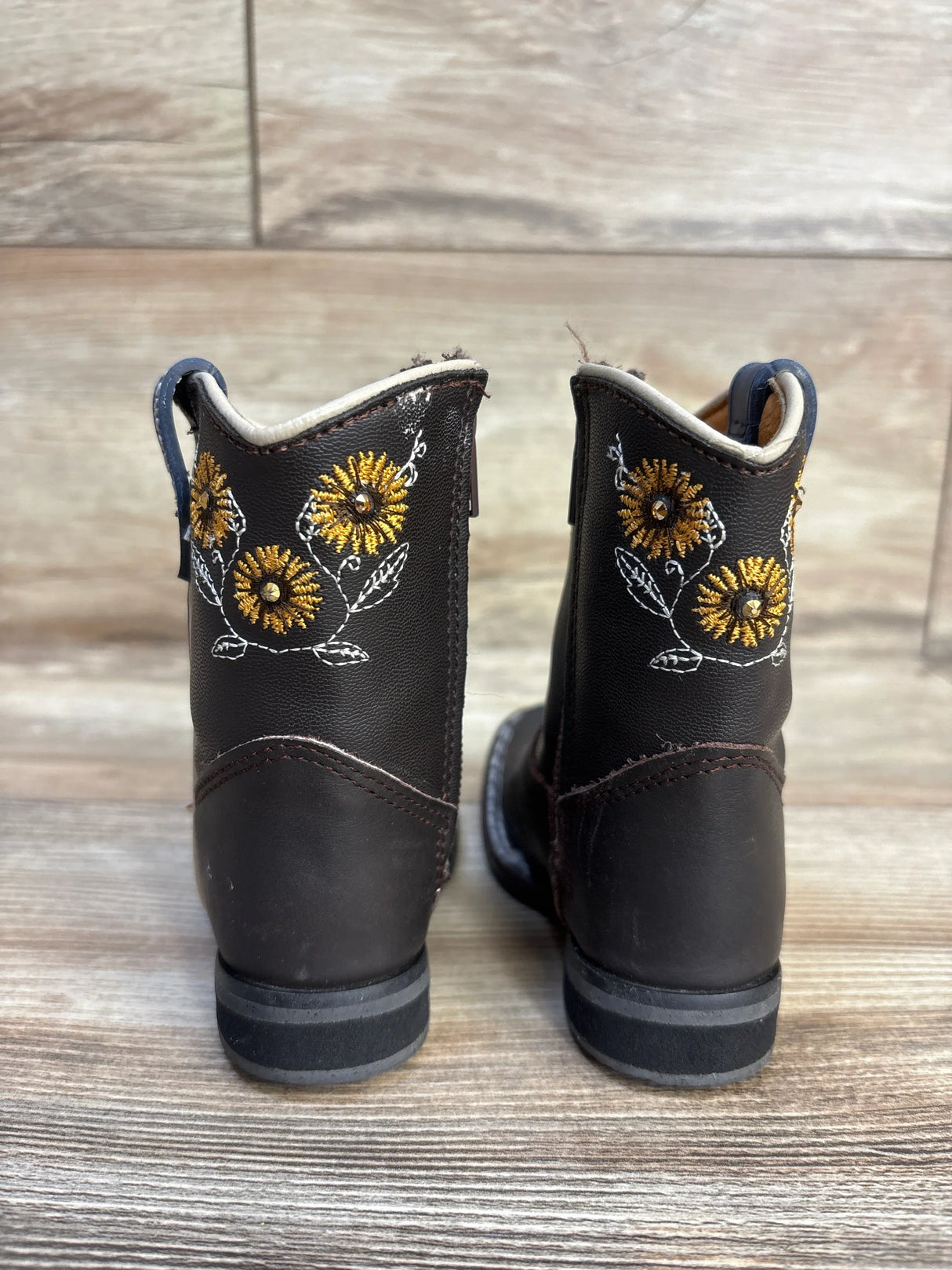 Black kids' cowboy boots with gold sunflower embroidery, perfect for toddler western wear or playtime outfits.