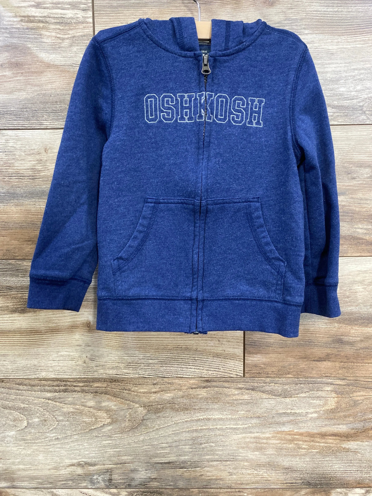 Navy blue kids' zip-up hoodie with hood and front pockets, featuring Oshkosh logo on chest