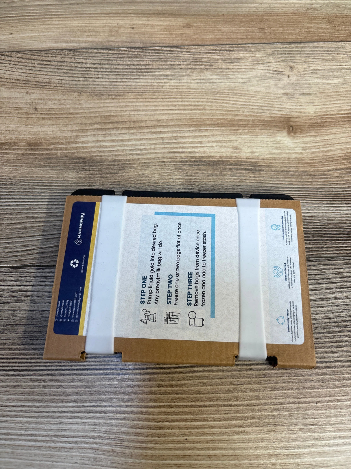 Brown cardboard package with printed instructions on a wood background, kids resale supplies.