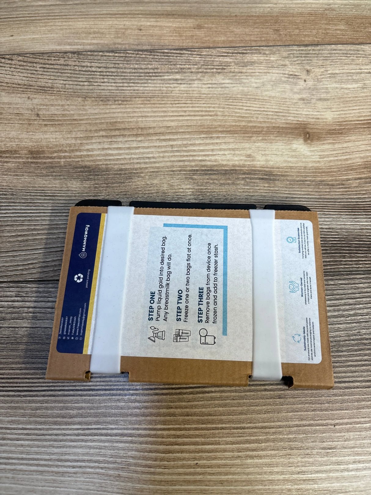 Brown cardboard package with printed instructions on a wood background, kids resale supplies.