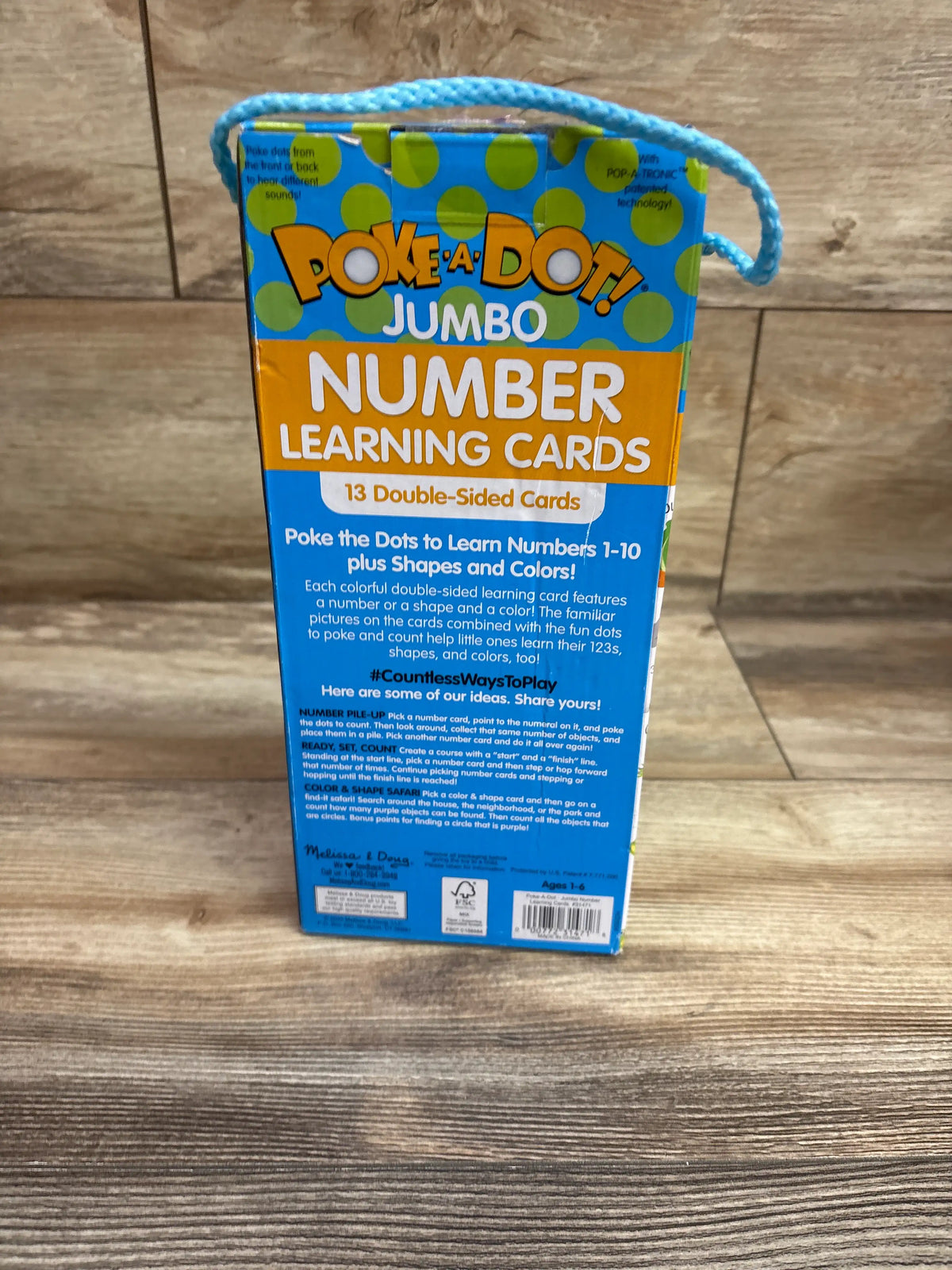 Back view of Melissa & Doug Poke-a-Dot Jumbo Number Learning Cards package showing 13 double-sided cards for numbers 1 to 10