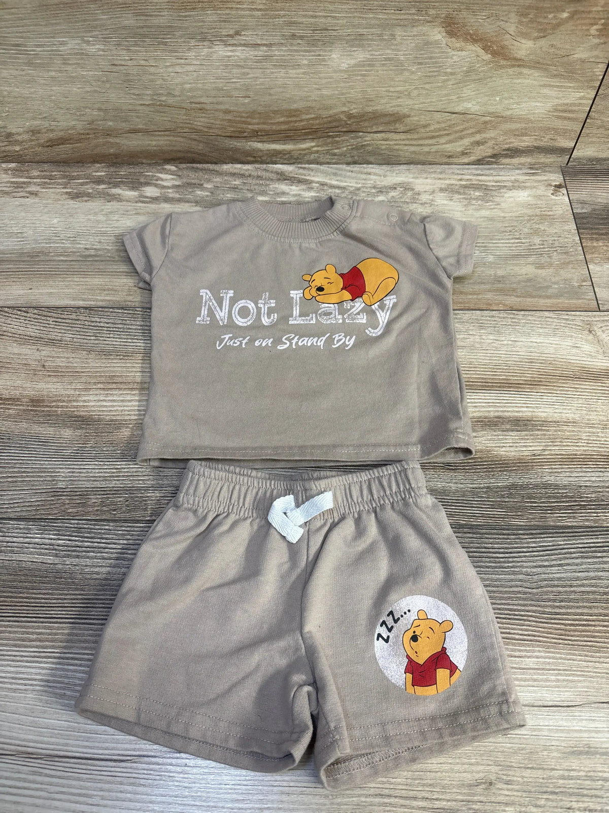 Disney Baby brown 2-piece set with Winnie the Pooh graphics, including shirt and shorts.