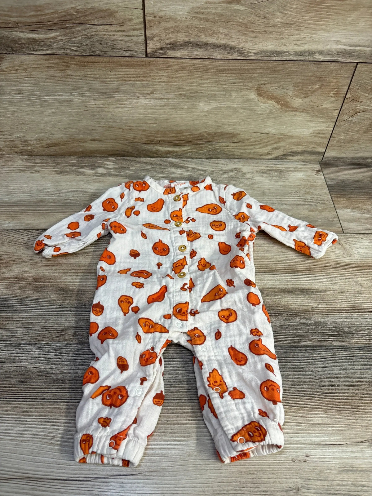 Front view of Cat & Jack white pumpkin-print baby coverall, size 0-3 months, with long sleeves and snaps