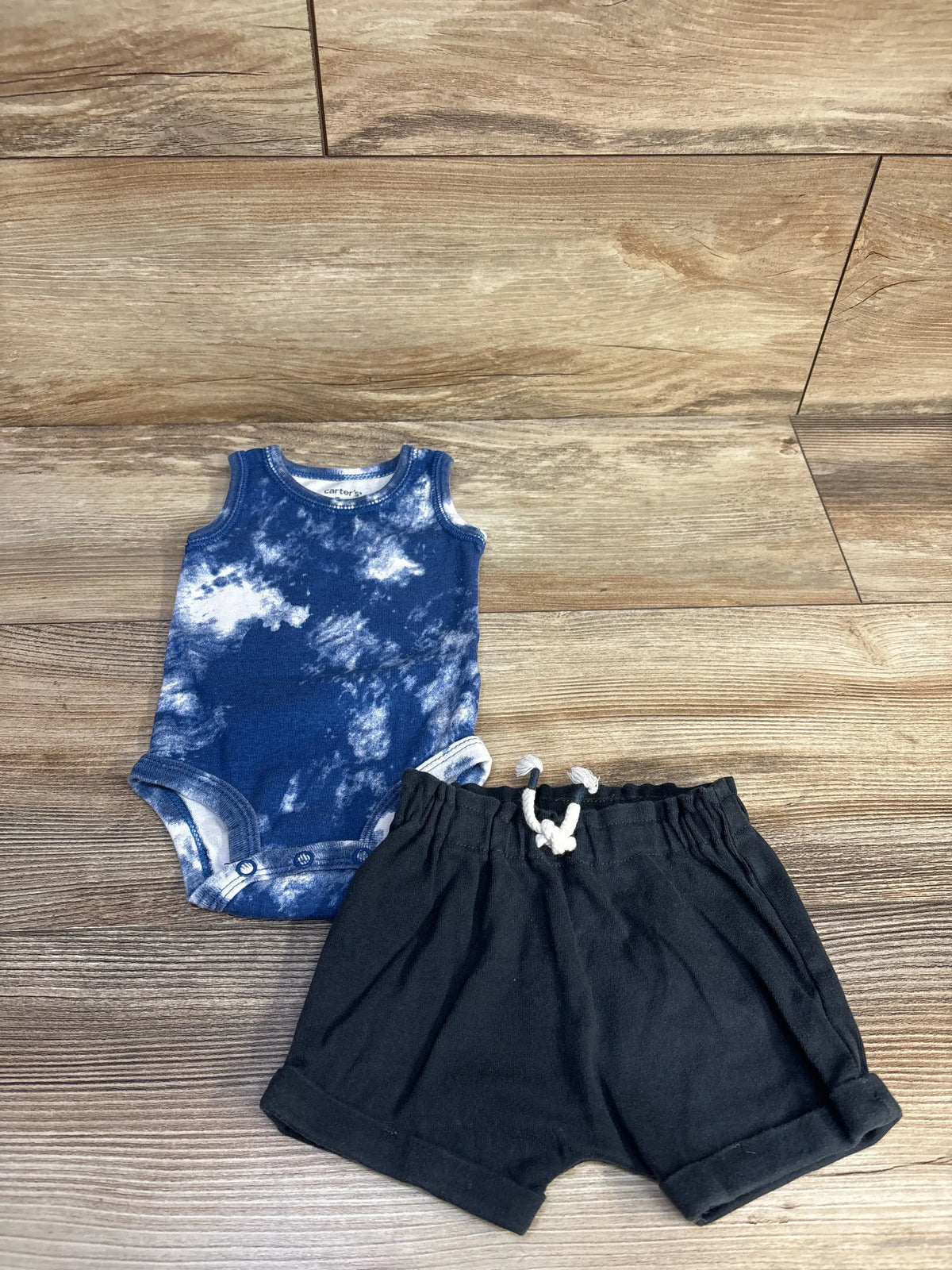 Front view of Carter’s two-piece tank bodysuit and shorts set showcasing blue tie-dye bodysuit and drawstring shorts