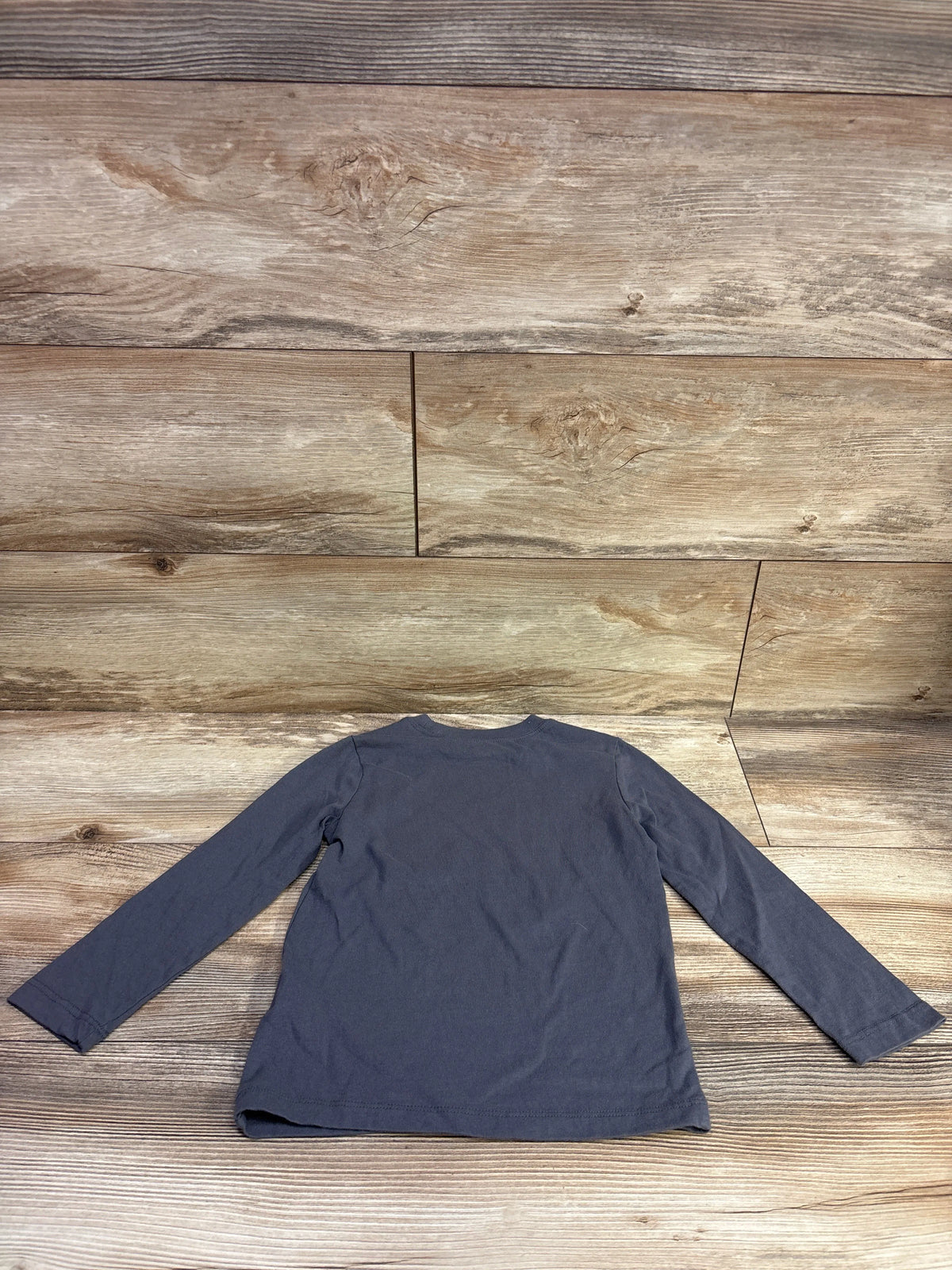 Back view of Carter’s It’s Fall Y’all grey shirt in size 3T showcasing long sleeves on a wood plank background