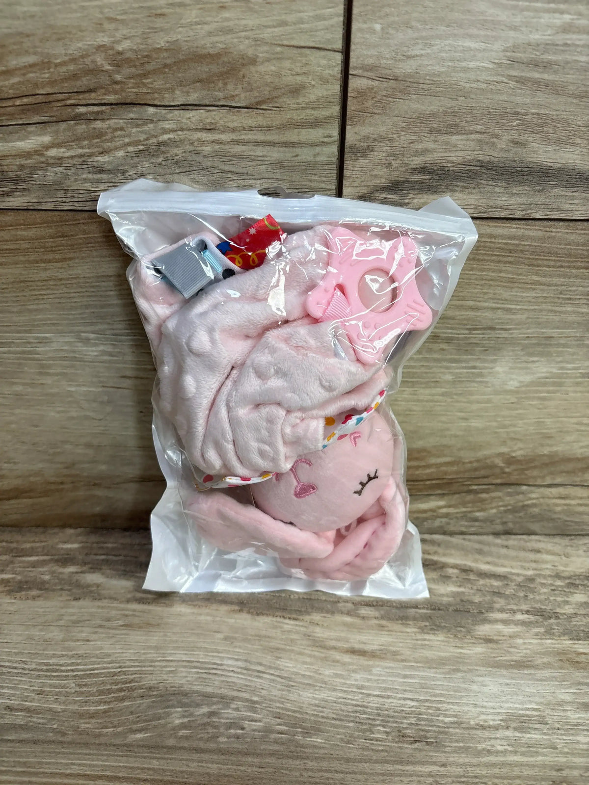 Front view of NEW Bbsky Bunny Security Blanket Pink with crinkle ears, tag-like ribbons, and silicone teether in clear bag