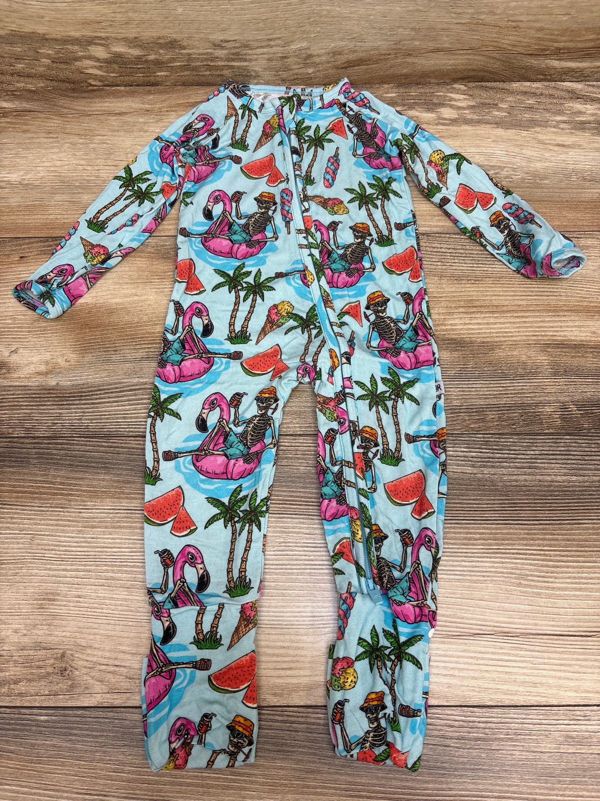 Front view of Bums & Roses Bone Chillin convertible footie, blue size 6-9m, with skeleton flamingo print on wood